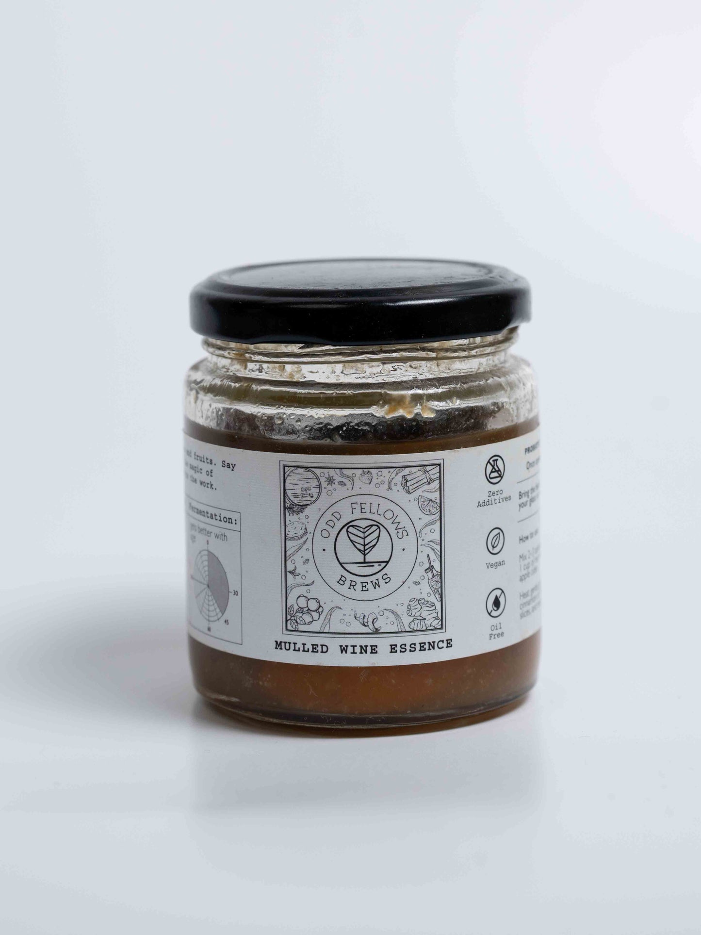 Jar of mulled wine essence with a label on a white background